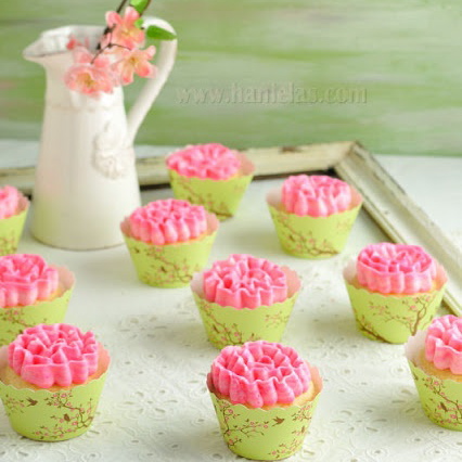 Pink frosting vanilla buttercream and cupcake wrappers